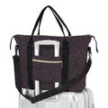 Black and gold patterned bag with a strap on a white background